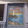 Lighthouse painted on a screen door